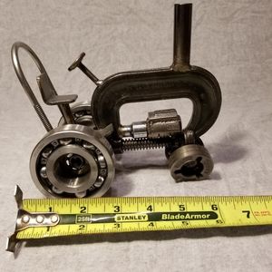 Tractor made.of scrap and c clamp.